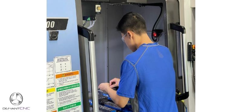 A Defiant CNC machinist busy at work.